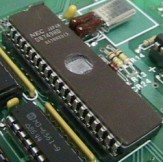 Photo of a Ceramic AM27S45 IC and a Plastic PAL16R8 IC