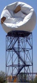 Storm damaged radome atop a Radar tower